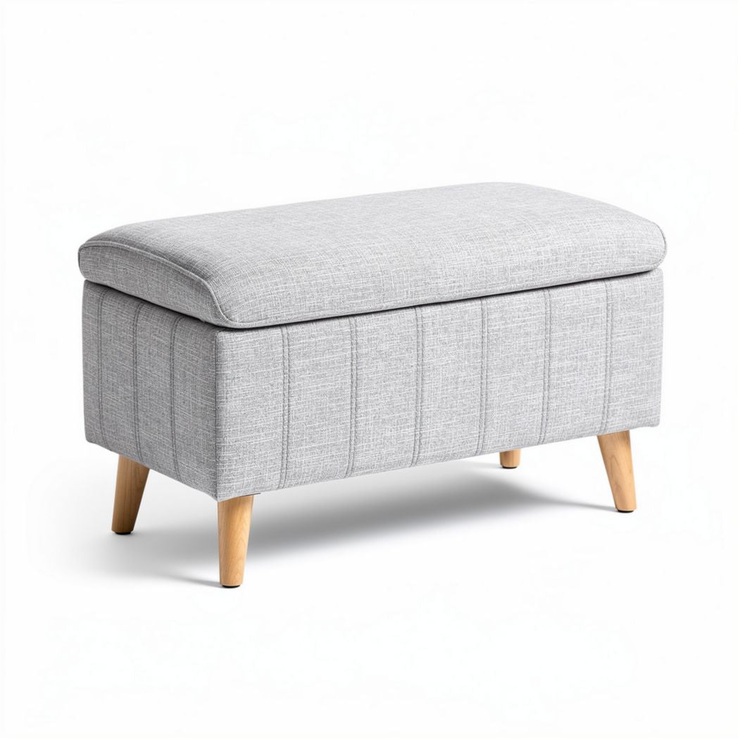 Storage ottoman with soft gray fabric upholstered surface and wooden legs 80 x 40 x 45cm